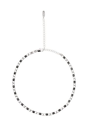 Silberne Kettenarmband mit abwechselnd schwarzen Akzenten, Gliedern in verschiedenen Formen und einem verstellbaren Verschluss mit Kettenverlängerung.