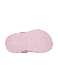 La suela de zapato de goma rosa presenta un diseño detallado con estrellas y una silueta de unicornio. La superficie tiene una textura con un agarre antideslizante.