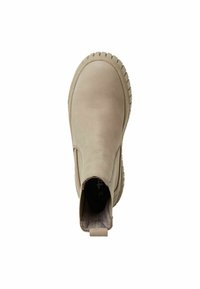 Beige slip-on boot made of textured leather with a rounded toe and a ridged rubber sole. Includes a small heel pull tab at the back.