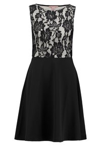 Robe noire avec un corsage en dentelle ajusté orné de motifs floraux et une jupe évasée. Modèle sans manches avec un col rond.