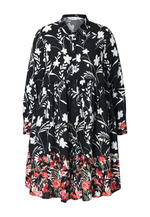 Schwarzes Kleid mit weißen Blumenmustern, langen Ärmeln, durchgehender Knopfleiste, gestuften Oberteil und einem bunten Blumenrand in Rot- und Orangetönen.