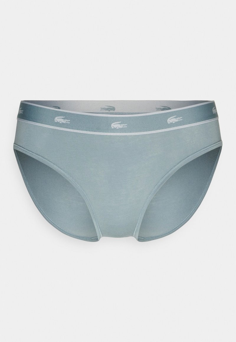Jasnoniebieskie bawełniane slipy z miękkim paskiem w talii, zdobione powtarzającymi się logo w jaśniejszym odcieniu niebieskiego. Gładka faktura i klasyczny krój.