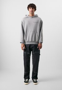 Don't Waste Culture KAJAL UNISEX - Calças de ganga folgadas - raw denim dark blue