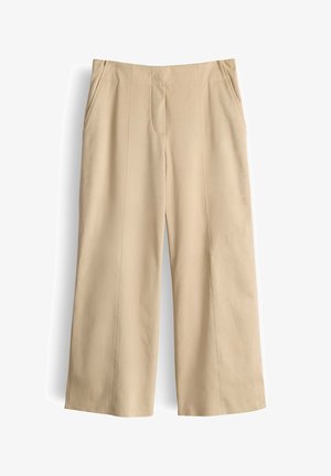 Pantaloni beige a gamba larga con tasche laterali, cuciture frontali e una vita aderente, mostrati distesi su uno sfondo bianco.