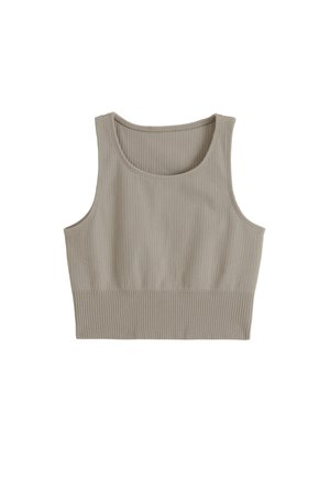 Top court sans manches côtelé beige clair avec encolure dégagée et larges bretelles.