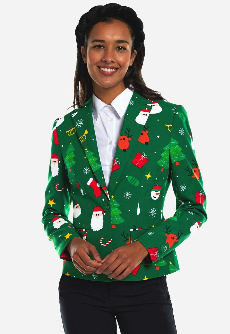 Blazer verde con un patrón festivo que incluye a Santa, renos, árboles y adornos, hecho de una tela texturizada y con un corte entallado.
