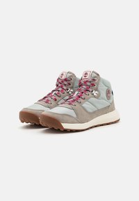 High-top athletic shoes in light blue and gray, made of suede and synthetic materials, with pink laces and a rubber sole.