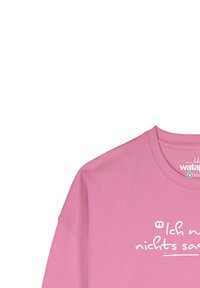 Roze sweatshirt met een ronde halslijn en een losse pasvorm, met witte tekst "Ich möchte nichts sagen" op de voorkant. Zachte, gestructureerde stof.