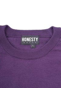 Purple knit sweater with a ribbed crew neck. Tag reads "HONESTY RULES" and size "L." Smooth texture, minimalistic design.
