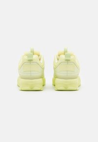 lime green fila disruptor