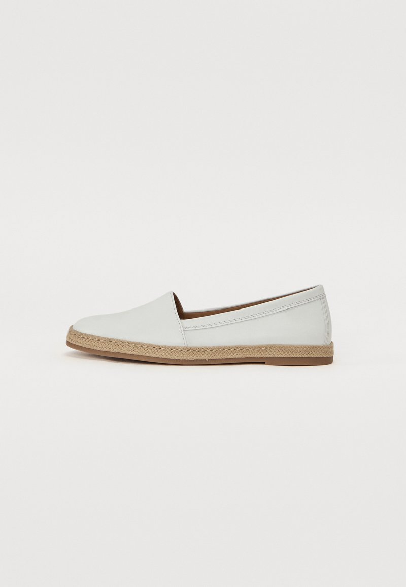 White leather flat shoe with a round toe and woven jute sole. Features a smooth finish and minimalistic design.