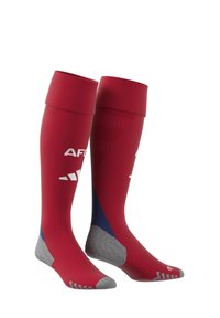 Červené sportovní ponožky do poloviny lýtek se šedým akcentem na špičce a patě, s texturovanými vzory a bílým logem na přední straně.