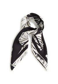 Svart-hvitt firkantet silkesjal med bladmønster, knyttet i en knute, med glatt tekstur og kontrasterende grafisk design.