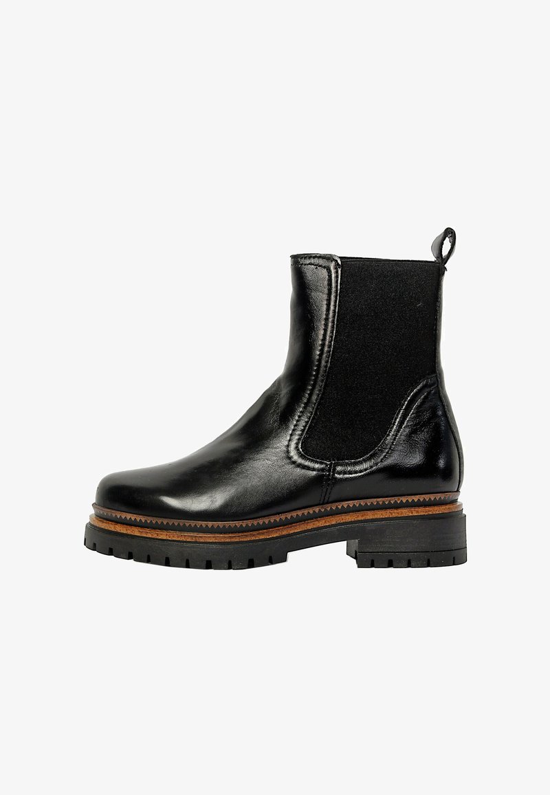 Bottine noire en cuir avec panneau latéral élastique, languette au talon, bordure marron au-dessus de la semelle crantée, et petit talon bloc.