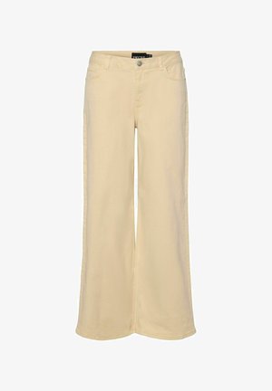 Bež hlače širokog kroja od mješavine pamuka, s kopčanjem na gumbe, pet džepova i kontrastnim šavovima.