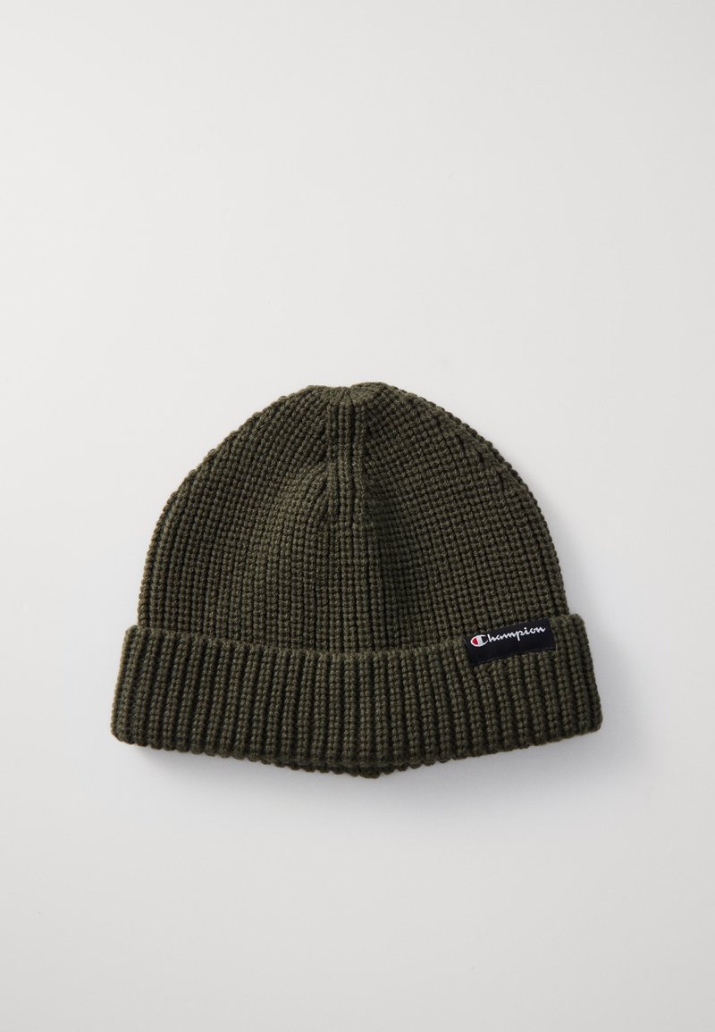 Knit beanie in dark green with a textured pattern, fold-up cuff, and a small Champion logo patch on the side.