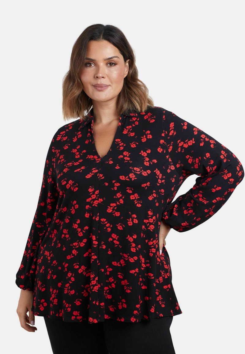 Schwarze Bluse mit floralem Muster und roten Blumen, V-Ausschnitt, langen Ärmeln und einem lockeren Schnitt. Hergestellt aus weichem Stoff mit einem leicht ausgestellten Saum.