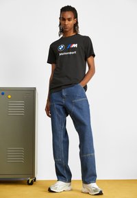 Puma LOGO TEE - Triko s potiskem - puma black