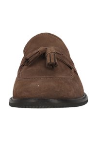 Brown suede loafers with a rounded toe, tassel accents at the front, and a flat black rubber sole. Smooth texture and simple design.