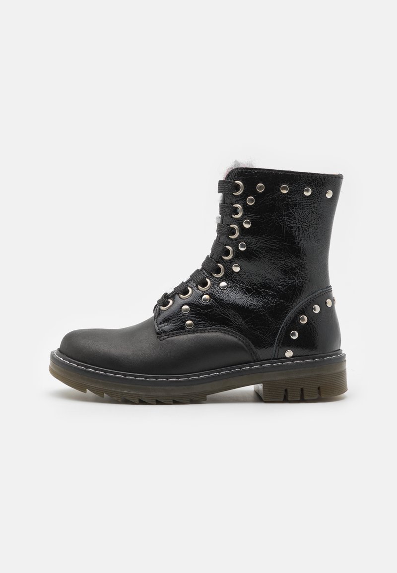 Black leather ankle boots with metal eyelets and studs, lace-up design, flat sole, stitched detailing, and a slightly textured finish.