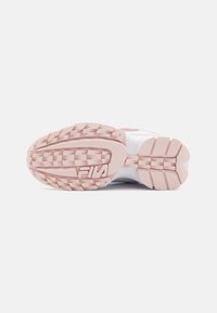 White athletic shoe sole with pink accents and textured grip pattern. Features prominent brand logo and reinforced heel design.