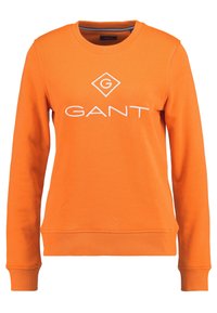 Felpa arancione in cotone, con collo a giro e maniche lunghe. La parte anteriore presenta il logo bianco "GANT" in forma di diamante.