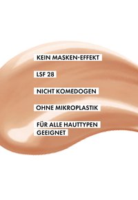 Hautfarbene Creme mit einer glatten, glänzenden Textur, präsentiert auf einem weißen Hintergrund, mit fettgedrucktem schwarzen Text, der die Produktvorteile beschreibt.