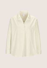 Langärmlige cremefarbene Bluse mit klassischem Kragen und verdeckten Knöpfen auf der Vorderseite, präsentiert vor einem hellen, neutralen Hintergrund.