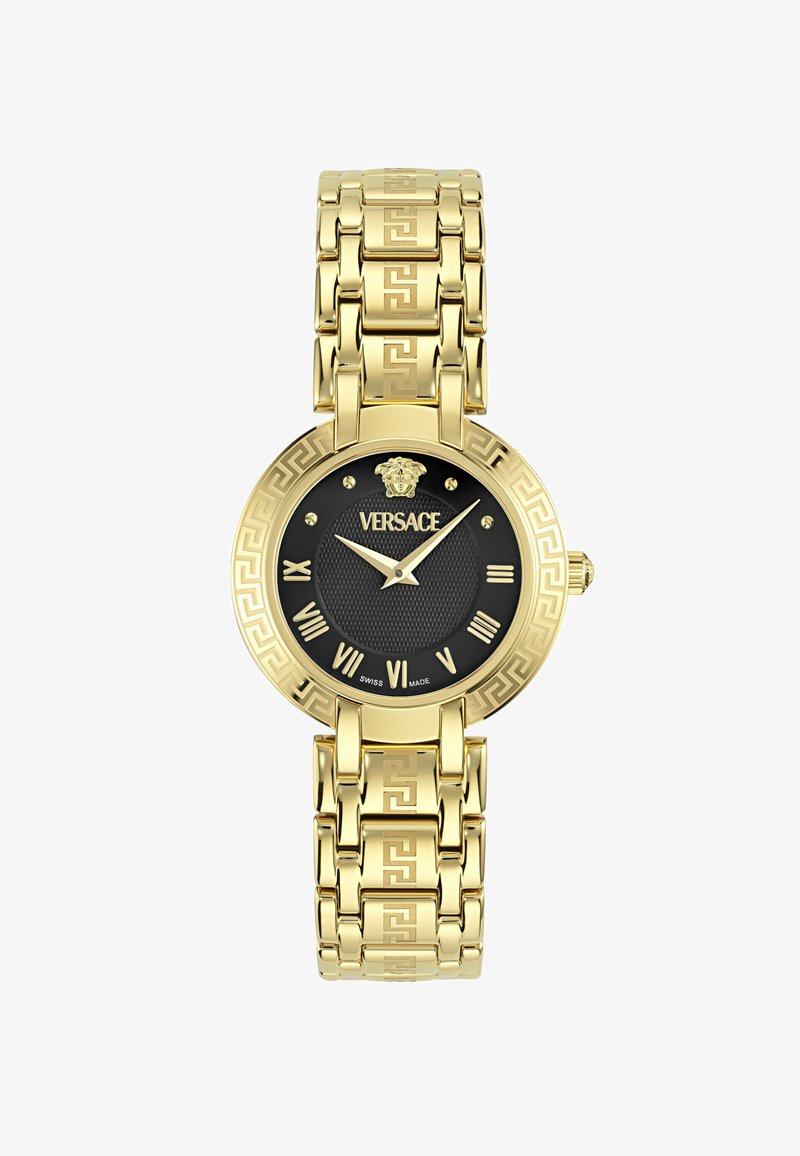 Orologio oro con quadrante rotondo nero, numeri romani e centro testurizzato. Il bracciale presenta un motivo a chiave greca.