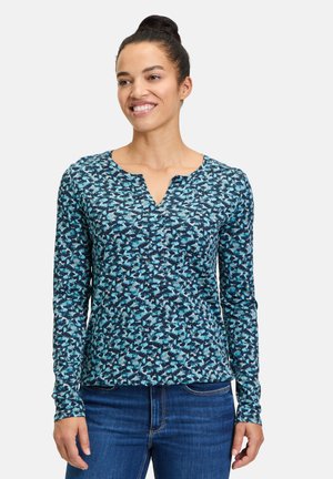 Langärmliges Hemd in Blau und Marine mit einem abstrakten Muster, featuring einem V-Ausschnitt und einer taillierten Passform. Hergestellt aus weichem Stoff.