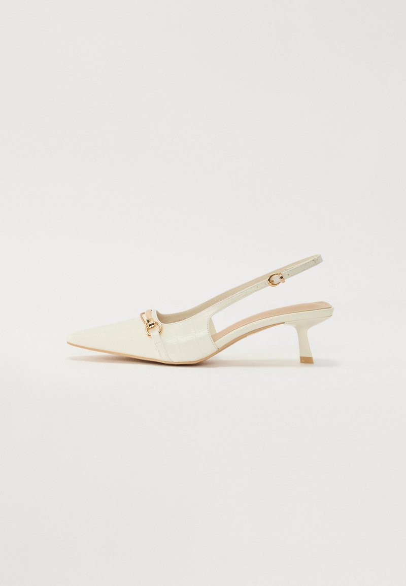 White slingback shoe with pointed toe and low heel. Features croc-embossed texture and a gold-tone hardware accent on the front.