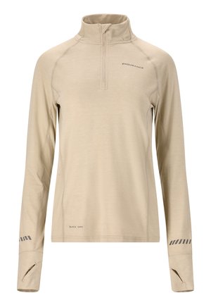 Beige long-sleeve pullover with a half zipper and high collar. Features flatlock seams, thumbholes in cuffs, and a quick-dry label.