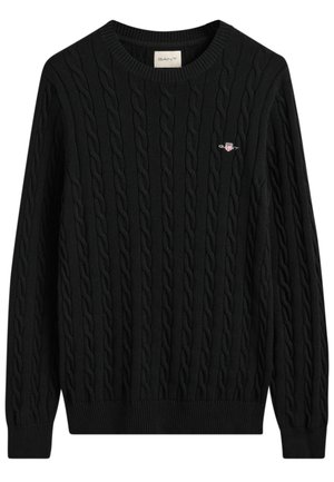 Black cable-knit sweater with a round neckline and ribbed cuffs, featuring a small branded logo on the chest. Crafted from soft fabric.