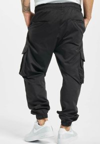 DEF FLO - Pantalon cargo - black
