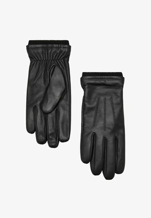 Guantes de cuero negro con una textura suave, que cuentan con puños elásticos, cuatro compartimentos para los dedos y un sutil detalle de costura en la parte posterior.