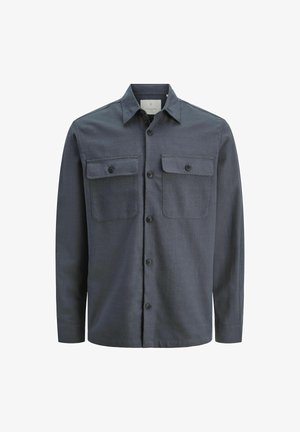 Tummansininen napitettava paita, joka on valmistettu tekstuurikankaasta. Mukana on kaksi etutaskua ja kaulus, pyöristetty helma sekä pitkät hihat.