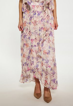 Gonna maxi floreale in tessuto leggero e trasparente. Presenta fiori viola e arancioni su uno sfondo crema. L'orlo è leggermente arricciato.