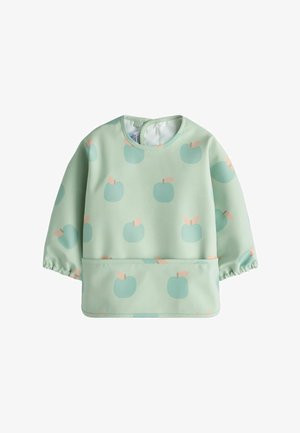 Groene lange mouwen top met een herhaald appelpatroon in lichtblauw en perzik. Gemaakt van een gladde, lichte stof met een ronde halslijn.