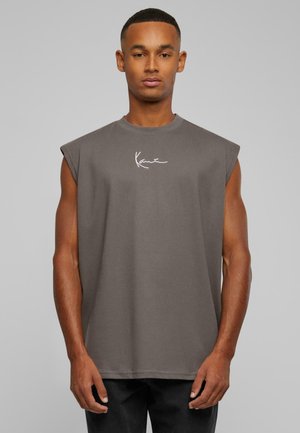 Gray sleeveless t-shirt with a round neckline, made of soft fabric, featuring a white signature logo on the chest. Simple design, relaxed fit.