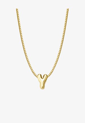 Zelta pārklājuma kaklarota ar elegantu Y formas piekari. Iespējama plakana, teksturēta ķēde ar kvadrātveida posmiem, kas atspoguļo minimālisma dizainu.