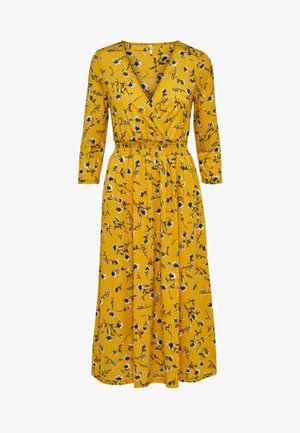 Gul omslagklänning med trekvartslång ärm, blommönster i svart och vitt, elastisk midja och midi-längd. Slät, mjuk tygtextur.