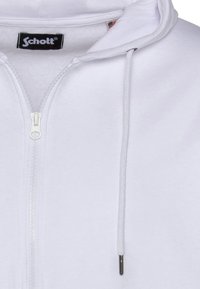 Felpa con cappuccio bianca con cerniera, realizzata in tessuto morbido, con cappuccio foderato, coulisse e cerniera argentata. Logo del marchio visibile sul collo.