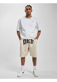 DEF PRINT  - Jogginghose - beige