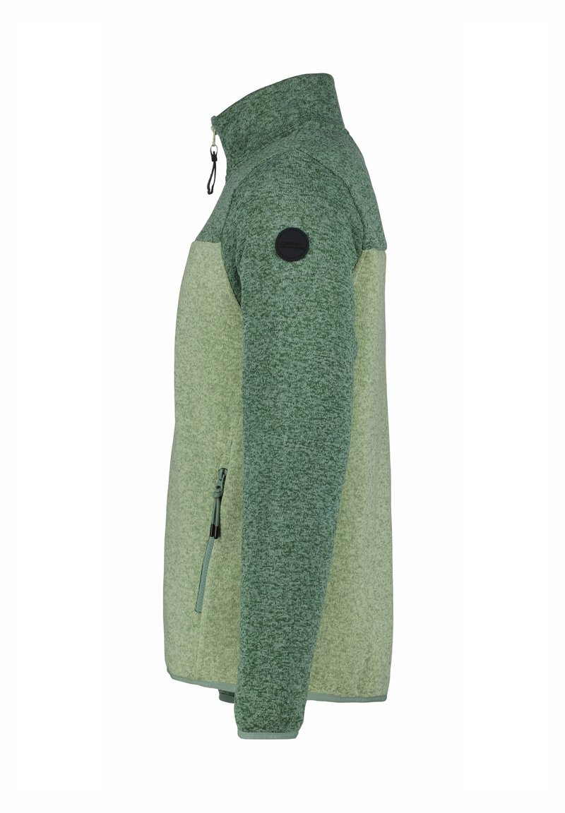 Giacca in pile con colletto alto, caratterizzata da un design bicolore in verde scuro e chiaro, tasca con zip e patch nero.