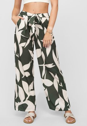 Pantalons à jambes larges en vert foncé avec un motif abstrait de feuilles crème. Dotés d'une ceinture à nouer et de poches latérales, fabriqués en tissu doux et léger.