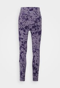 Fioletowe legginsy z wzorem w plamy w ciemniejszych odcieniach, wykonane z elastycznego materiału. Wysoki pas zapewniający pewne dopasowanie.