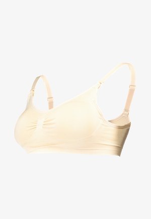 Soutien-gorge d'allaitement beige en tissu doux, avec des bretelles ajustables, un centre froncé et une surface lisse sans coutures pour plus de confort.
