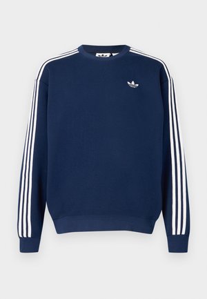 Teget plava majica dugih rukava od pamuka, s bijelim trostrukim prugama na rukavima i malim bijelim logom na prsima.