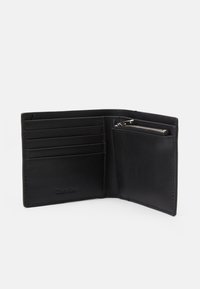Black leather wallet with multiple card slots and a zippered coin pocket. Smooth texture with subtle branding on the interior.