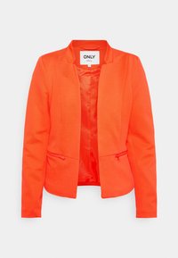 Blazer orange en tissu texturé, devant fermé, avec deux poches zippées. Il présente un col cranté et une doublure intérieure lisse.